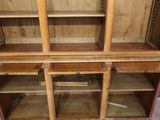 an image of a wooden cabinet with open shelves