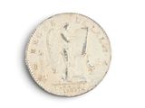 an old coin with a picture of a man on it