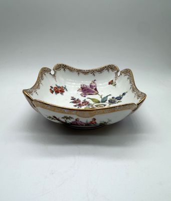 a close up of a bowl on a table with a white background