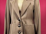 jacket on a mannequin stand on a red background