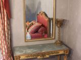 a mirror on the wall in the corner of a room