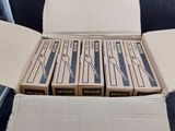 six boxes of pizza sitting in a box on a table