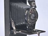 an old photo of an old camera on a stand