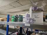 many boxes on the shelves in the warehouse