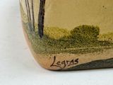 a vase that has a picture of a tree on it