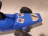 a blue toy car that is sitting on a table