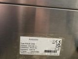 an image of a stainless steel oven with a label on it