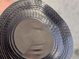 a person holding a roll of black tape in their hand