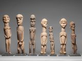six carved wooden figures of different sizes and shapes