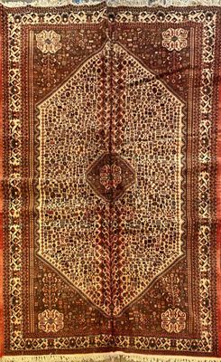 an antique persian rug with an intricate design on a red ground
