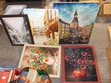 a lot of paintings and other items that are on the floor