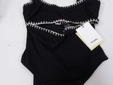 a close up of a swimsuit with a tag on it
