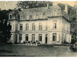 an old photo of a large building with a lot of windows