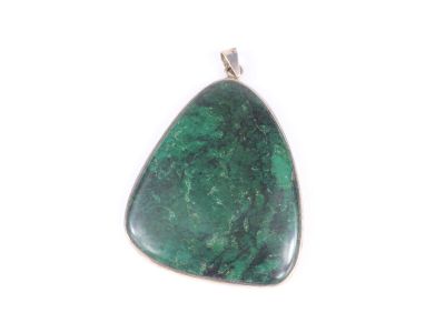 a close up of a green stone pendant on a white background