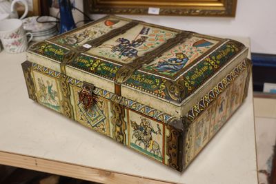 a box that is sitting on a table in front of a painting