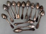 a lot of spoons that are sitting on a table