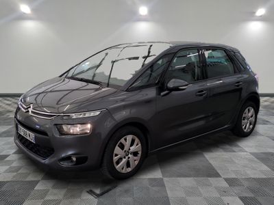 the grey citrole is parked on a checkered tile floor