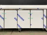 a group of three freezers sitting on top of a counter