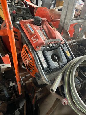 a picture of a pile of tools and equipment in a garage