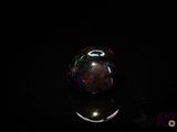 an image of a glass ball in the dark
