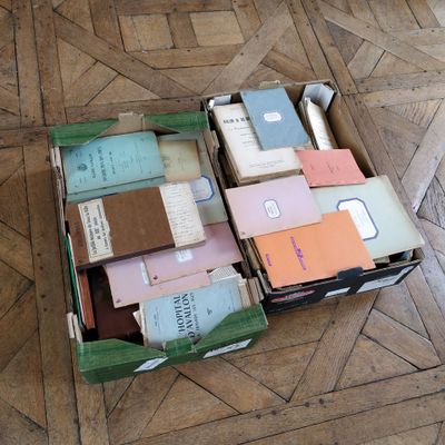 a box full of books on the floor on the floor