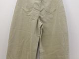 the back of a pair of khaki pants hanging on a hanger
