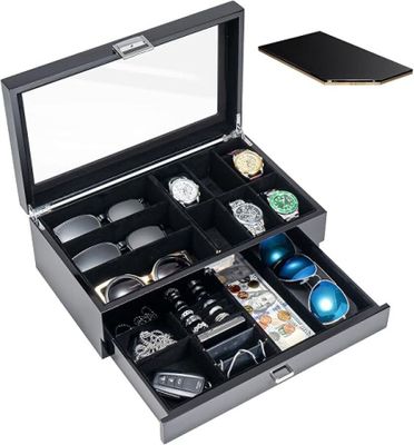 a close up of a box with a watch and other items in it