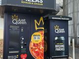 two vending machines that are on the side of the road