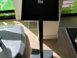 a table with a laptop on it in front of a window