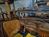 a chair that is next to a pile of wood