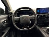 the interior of a car with a steering wheel, dashboard, and dashboard controls