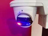 an image of a security camera mounted on a wall