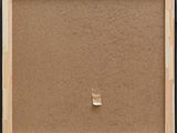 a close up of a picture frame with a piece of paper sticking out of it