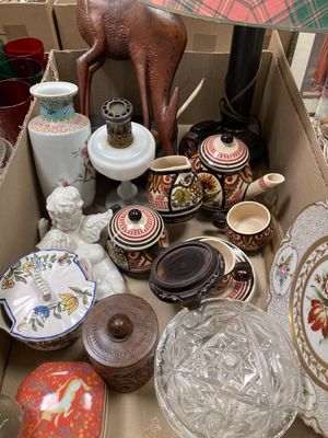 a box full of assorted vases and plates