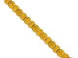 a yellow bracelet with a spiral design on it