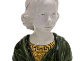 a figurine of a woman wearing a green dress