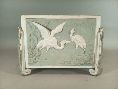 two birds that are standing on a table