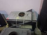 a microwave sitting on top of a table next to other appliances