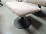 two chairs and a foot stool in a room