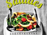 a plate of salad with a fork and knife on it