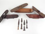 four knives and a knife sharper on a white surface