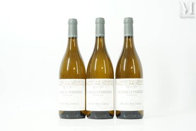 three bottles of wine sitting next to each other on a table