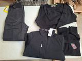 a pile of clothing on a table with a fire place in the background