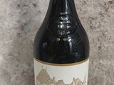 a bottle of wine that is sitting on a table