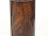 a small wooden table with a marble top on it