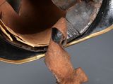 a close up of a shoe with a broken shoelace