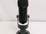 a close up of a microphone on a stand with a white background