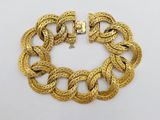 an image of a gold chain bracelet with a clasp