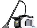 a black and white photo of a vacuum cleaner with a black handle