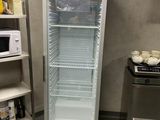 an image of a commercial refrigerator in a kitchen